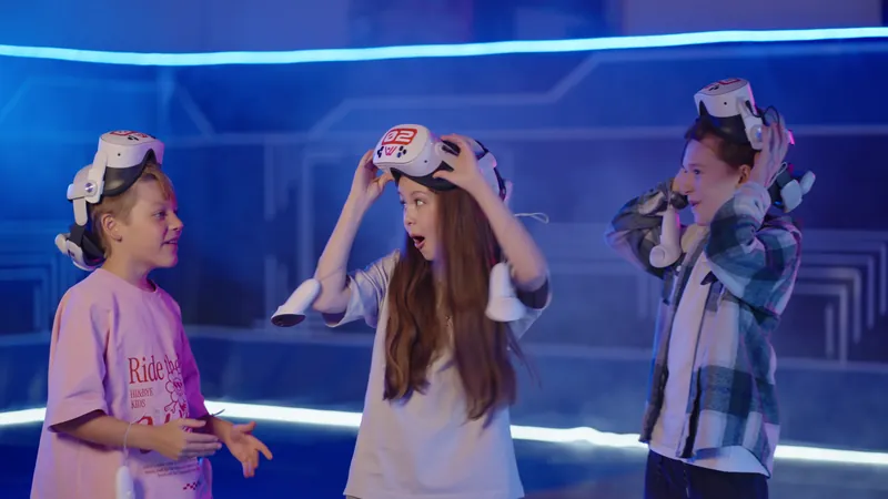 Excited kids taking off their VR headsets